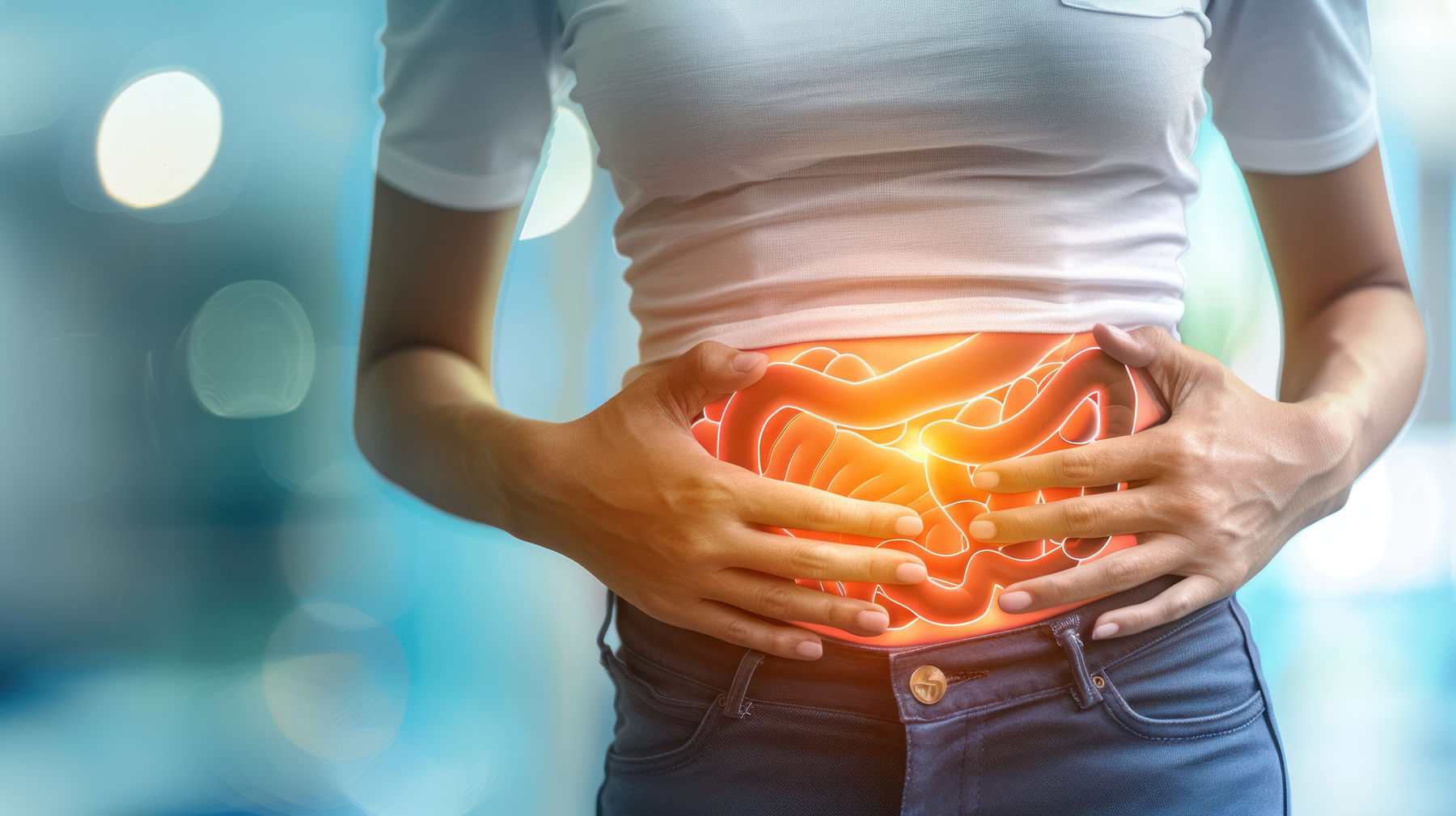 Person holding their stomach with a glowing illustration of intestines